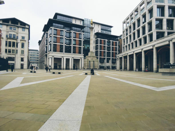 London Lockdown - Empty City lunchtime in the  City London / UK - March 19th 2020: Paternoster Square by The London Stock Exchange, City of London which is normally busy at lunchtime is deserted as people work from home during the COVID-19 coronavirus paternoster square stock pictures, royalty-free photos & images