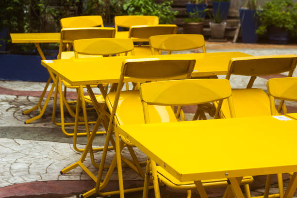 istock summer cafe with yellow tables and chairs, a place for lunch 1218751263