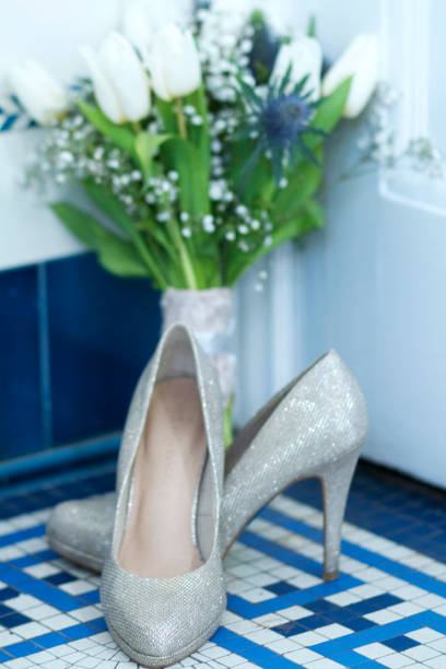 Vintage bridal bouquet & Shoes on a mosaic floor