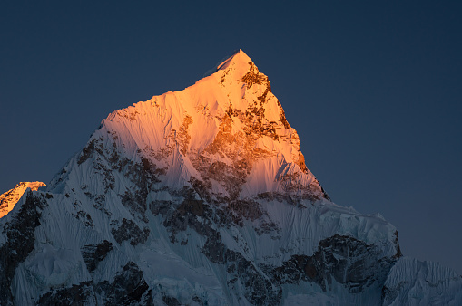 Sunset over Nuptse mountain peak from Kalapattar view point, Everest base camp trekking in Himalaya mountain range, Nepal, Asia
