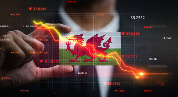 istock Graph Falling Down in Front Of Wales Flag. Crisis Concept 1218753601