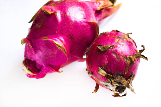 istock two dragon fruit on a white background, tropical fruit 1218756181
