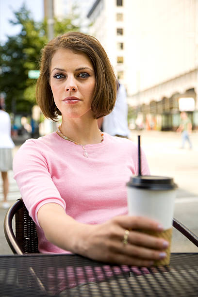 istock Young Woman at Coffee Shop 121875628