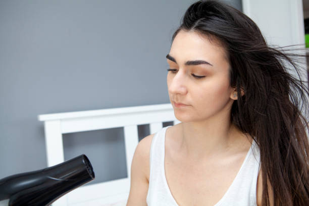 istock Teenager drying hair 1218756629