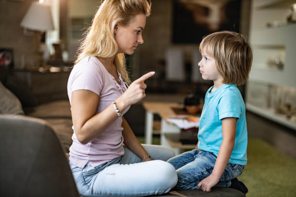 istock Angry single mother scolding her small son at home. 1218758092