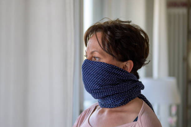 istock Hispanic woman wearing a blue face guard 1218759678