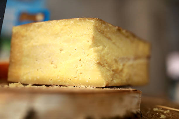 istock Piece of yellow cheese on counter 1218763972