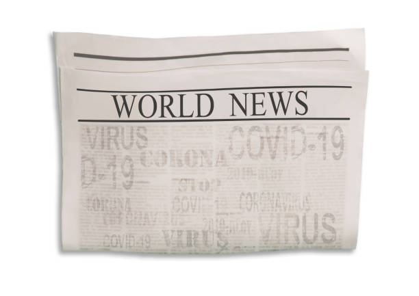 istock Coronavirus Covid-19 news. Newspaper with headlines on horizontal surface. 1218764922