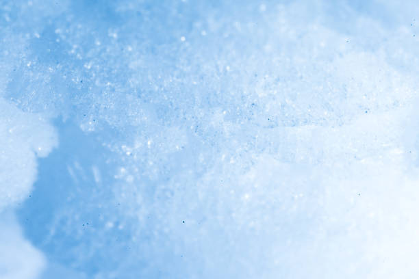 istock Fresh fluffy white snow texture.White snowflakes.Snow surface.soft focus. 1218766037