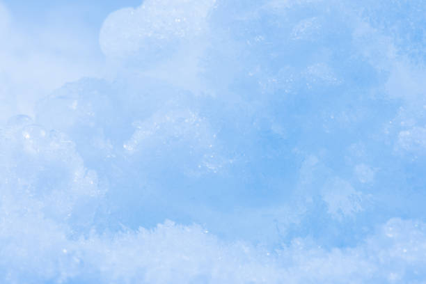 istock Fresh fluffy white snow texture.White snowflakes.Snow surface.soft focus. 1218766129