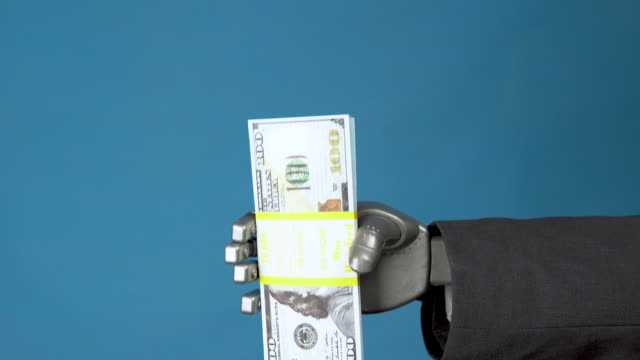 Cyborg businessman in a suit holds a pack of dollars. A mechanical hand shows a bundle of money on a blue background