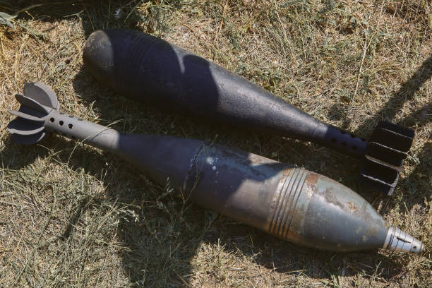 istock Two unexploded aerial bombs lie on the ground 1218769398