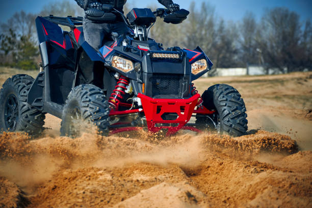 istock Racing in the sand on a four-wheel drive quad. 1218770466