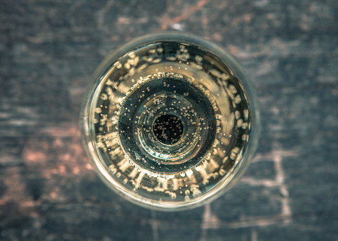 White wine in a glass. View directly from above