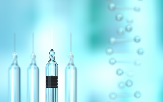 Covid-19 coronavirus vaccine syringe on blue background