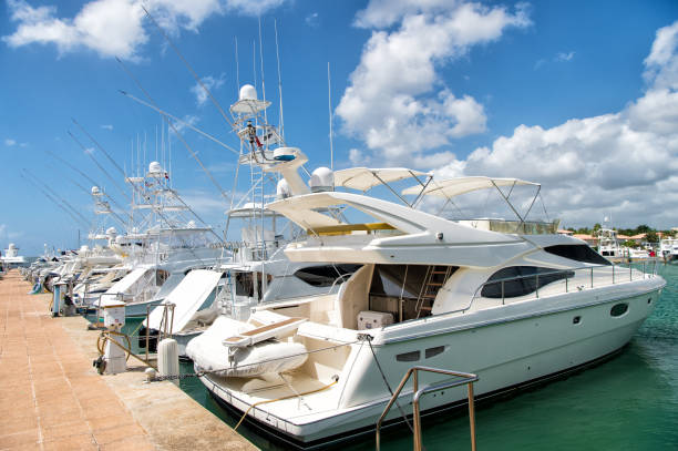luxury yachts docked in the port in bay at sunny day with clouds on blue sky in La Romana, Dominican Republic