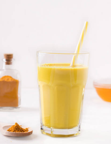 istock indian drink golden milk next to ingredients 1218772889