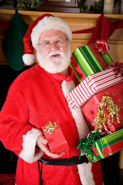 istock Santa Claus Holding Presents 121877325