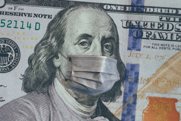 istock Franklin with face mask on 100 US dollar bill 1218773724