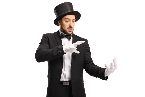 istock Magician wearing white gloves and performing a trick with his hands 1218776248