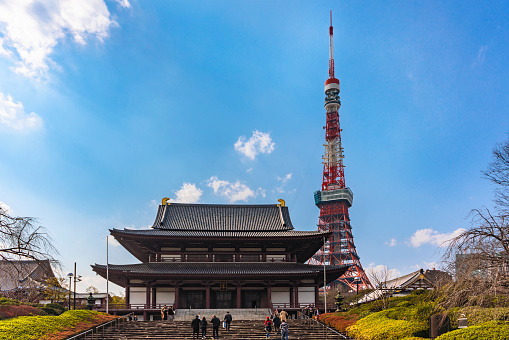 tokyo, japan - march 05 2020: Japanese zojoji temple which is the funeral temple of the Tokugawa shoguns near the Tokyo tower during a beautiful sunny day.