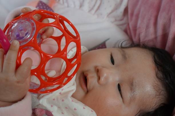 baby playing with O'ball