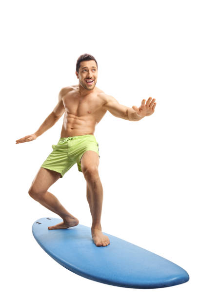 istock Young fit man surfing on a surfboard 1218777673