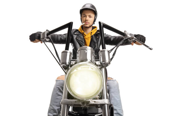 istock Young guy riding a motorbike an smoking a cigarette 1218777699