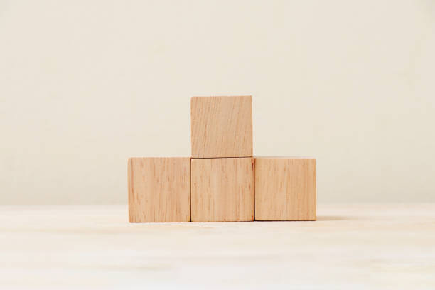 istock Wooden cube four pieces stacked on the floor. 1218777823