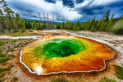 Morning glory pool from above. Stormy weather. Yellowstone National Park, Wyoming, USA
