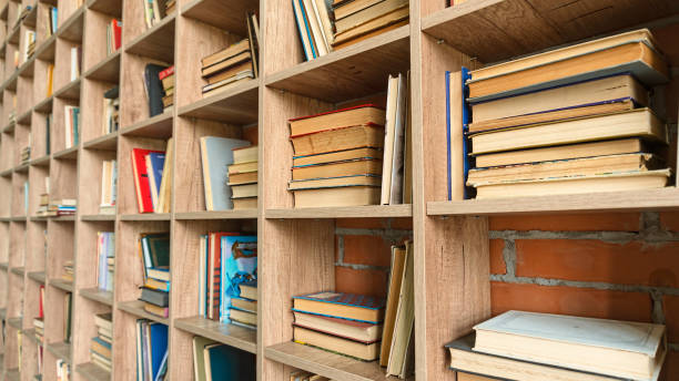 istock Bookshelves with books close-up. Education concept 1218781172