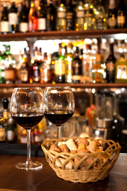 istock glasses of red wine in restaurant 1218783912