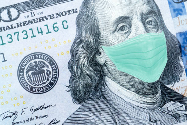 istock Benjamin Franklin With Worried and Concerned Expression Wearing Medical White  Face Mask On One Hundred Dollar Bill 1218784465
