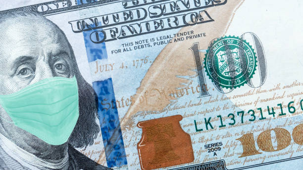 istock One Hundred Dollar Bill With Medical Face Mask on Benjamin Franklin. 1218784504