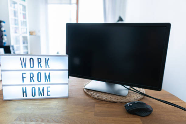istock Working from home remote work inspirational social media lightbox message board next to monitor, COVID-19 quarantine closure of all 1218786679