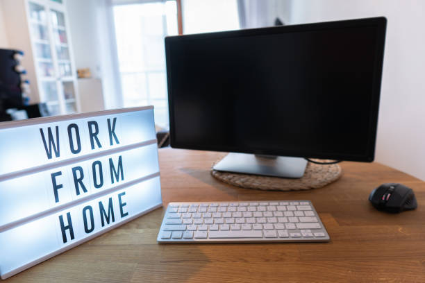 istock Working from home remote work inspirational social media lightbox message board next to monitor and keyboard and mouse, COVID-19 quarantine closure of all. Apartment background 1218786814