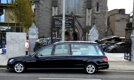 13th April 2020, Dublin, Ireland. Empty hearse outside the Immaculate Heart of Mary Church on City Quay, Dublin Docklands, Dublin city centre.