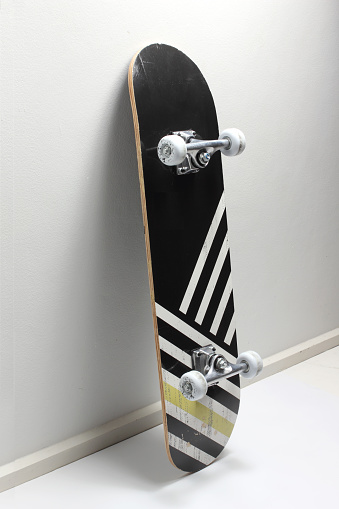 Skate Board Leaning on Wall
