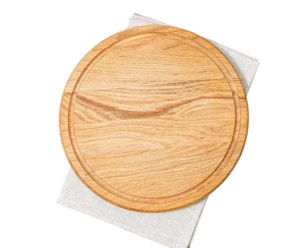 istock Pizza board with napkin with shadow isolated on white. Empty pizza board top view mock up - Wooden plate for meat and vegetable on white background 1218789928