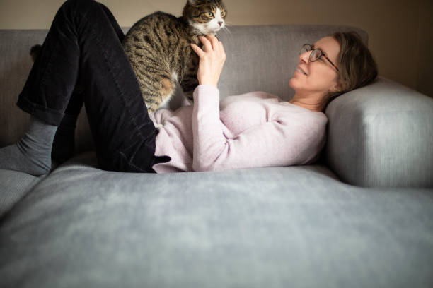 istock Woman and her cat 1218791131