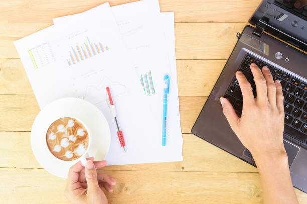 istock Work from home with hot coffee on the table / hot coffee with laptop on work space 1218793047