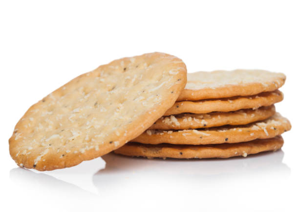 istock Stack of round organic crispy wheat  flatbread salty crackers on white. 1218794516