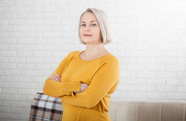 Active Beautiful Middleaged Woman Smiling Friendly And Looking Into The  Camera Woman39s Face Close Up Stock Photo - Download Image Now - iStock