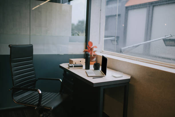 istock a office room interior with office chair and table beside window 1218797566
