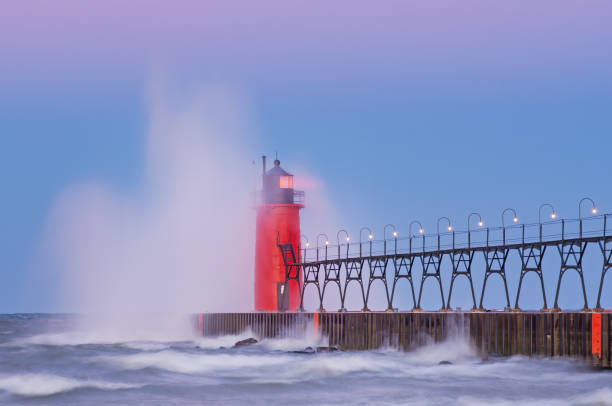 istock Summer South Haven Lighthouse with Crashing Wave 1218799886