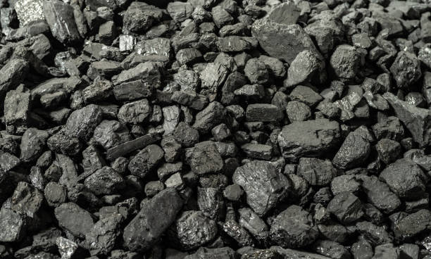 Anthracite is the best type of hard coal. Panoramic background from pieces of anthracite. Anthracite is the best type of hard coal. Panoramic background from pieces of anthracite. Selective focus. coke coal stock pictures, royalty-free photos & images