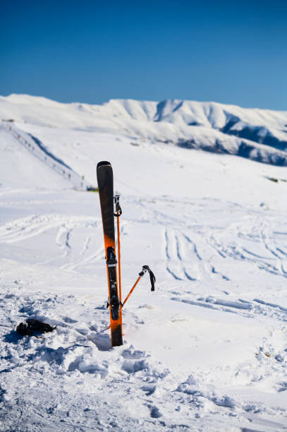 istock Skis in snow at mountain top 1218804879