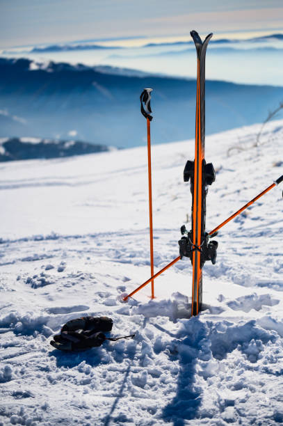 istock Skis in snow at mountain top 1218804962