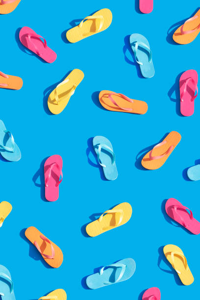 Flip-flops Flip-flops isolated on blue background thong stock pictures, royalty-free photos & images