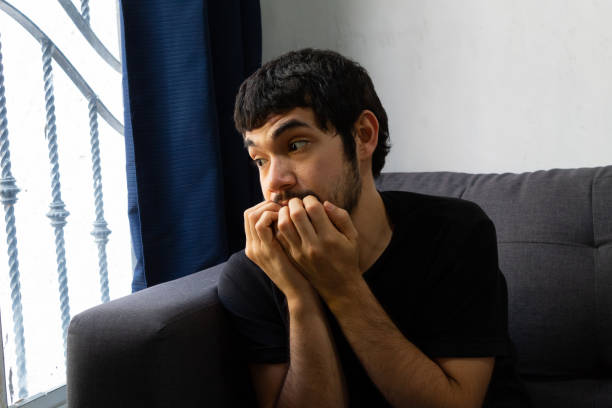 istock Bearded Hispanic young man demonstrating negative emotions such as depression, anxiety, sadness, loneliness, fear, nerves, frustration among other concepts 1218805489